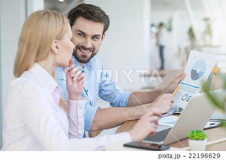Cheerful two colleagues are working together 22196629