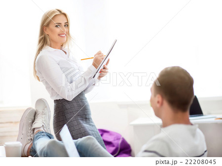Cheerful colleagues working in the office  22208045
