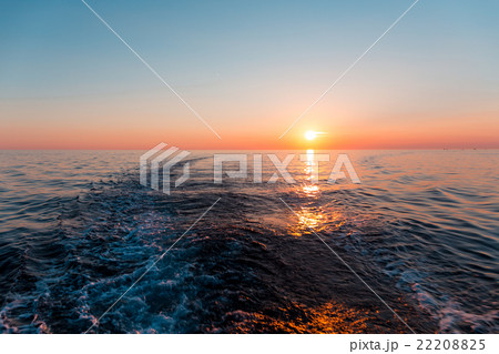 Sea sunset with ship trace 22208825