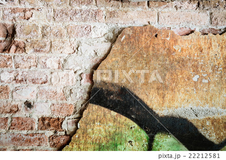 Dirty concrete wall with graffiti and big crack 22212581