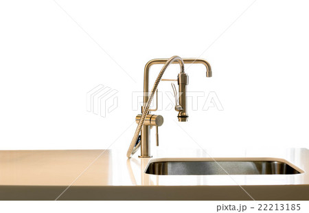 Metal modern design faucet in a kitchen isolated 22213185