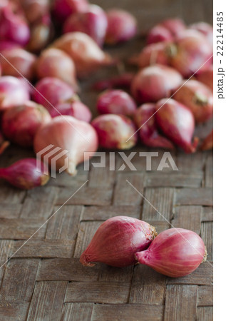 Two shallots on blurred shallots background. 22214485