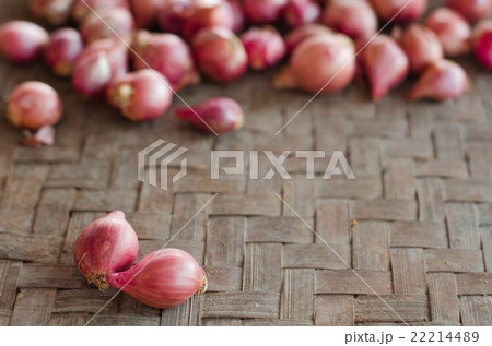 Two shallots on blurred shallots background, 22214489