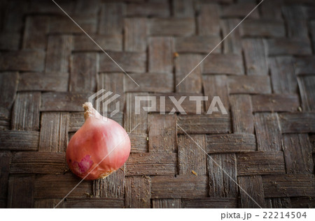 Shallots on mat with vignette background. 22214504