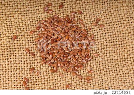 close up of flax seeds on canvas  background 22214652