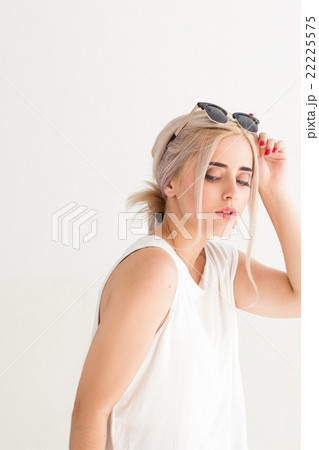 Woman with black sunglasses on head 22225575