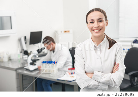 Cheerful female researcher is evincing positive 22229698