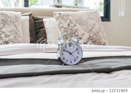 classical alarm clock on bed classical alarm clock on bed 22232804