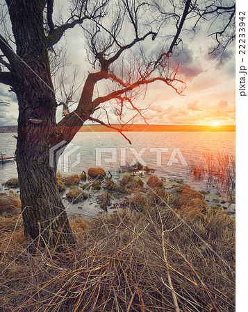 Cloudy weather over the lake at sunset Cloudy weather over the lake at sunset 22233942