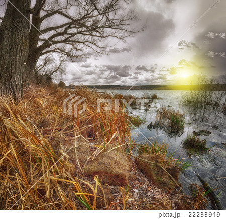 Cloudy weather over the lake at sunset Cloudy weather over the lake at sunset 22233949