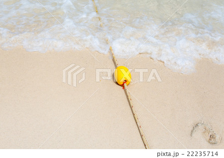 Yellow buoy on the beach Yellow buoy on the beach 22235714
