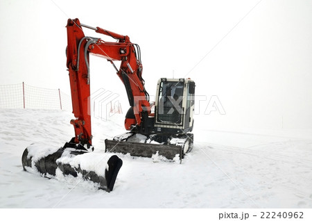 Tracklaying excavator at top of snow mountain Tracklaying excavator at top of snow mountain 22240962