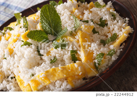 Cauliflower rice with egg and mint on a plate 22244912