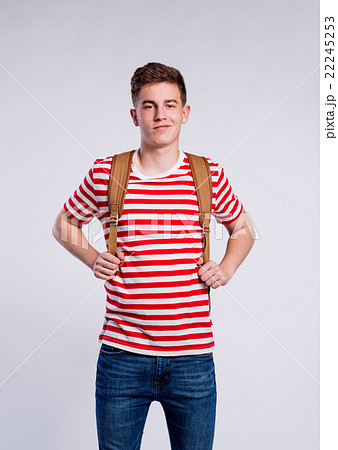 Boy in jeans and t-shirt, young man, studio shot Boy in jeans and t-shirt, young man, studio shot 22245253