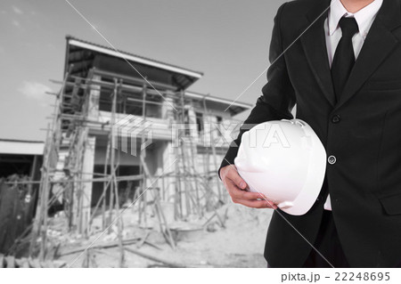 engineer holding helmet with house construction engineer holding helmet with house construction 22248695