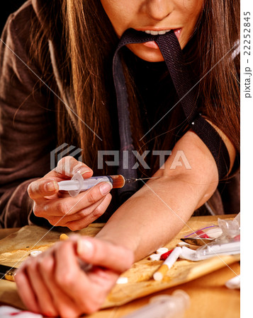 Female drug addict with   syringe. 22252845