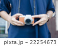 blurry girl use digital camera 22254673