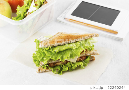 Sandwich with lettuce, cheese, tomato and lemonade 22260244