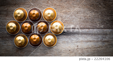 Nespresso capsule on wooden background. 22264106