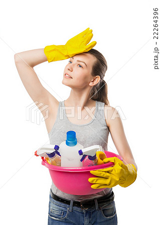 Smiling young woman with cleansers isolated 22264396