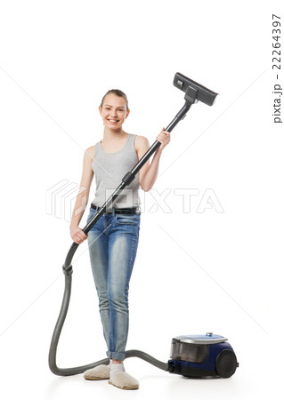 Smiling woman with vacuum-cleaner isolated Smiling woman with vacuum-cleaner isolated 22264397