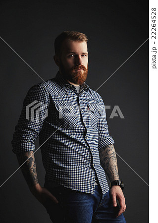 Red bearded man with tattoes studio portrait on Red bearded man with tattoes studio portrait on 22264528