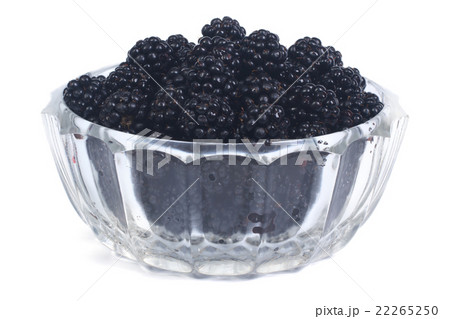 ripe blackberries in a glass bowl isolated 22265250