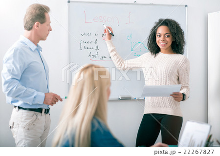 Young student answering near the blackboard 22267827