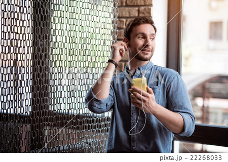 Pleasant man listening to music    22268033