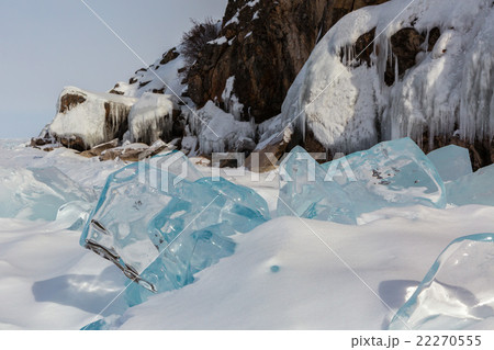 Transparent icicles in the snow on a background of Transparent icicles in the snow on a background of 22270555