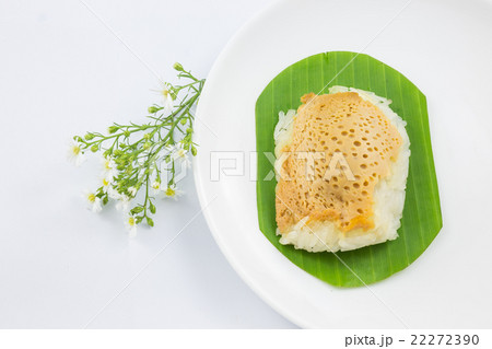 sticky rice with steamed custard on banana leaves sticky rice with steamed custard on banana leaves 22272390