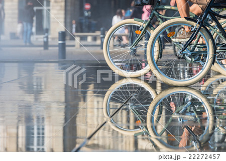 People riding bicycles in the mirror fountain People riding bicycles in the mirror fountain 22272457