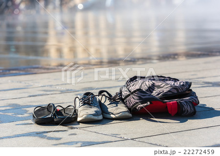 Family Shoes left near the water 22272459