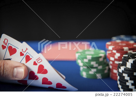 Queen, Jack, Ten in hand and gambling chips on Queen, Jack, Ten in hand and gambling chips on 22274005