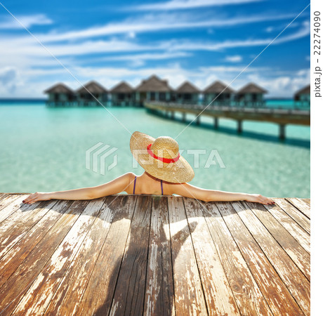Woman at poolside 22274090