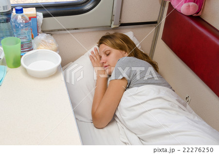 The girl on the train is fast asleep at a lower second-class place car coupe The girl on the train is fast asleep at a lower second-class place car coupe 22276250