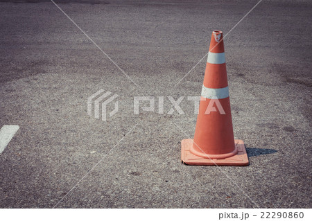 parking lot with traffic cone on street 22290860