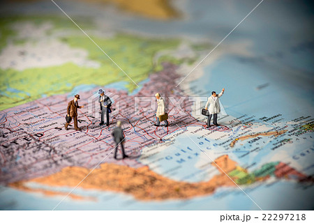 Miniature business people on top of US map. Miniature business people on top of US map. 22297218