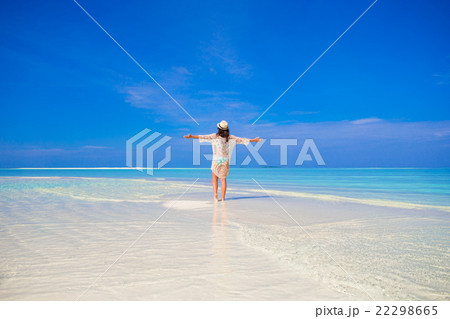 Young happy woman having fun on tropical white 22298665