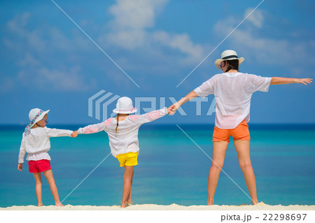 Little girls and mother on tropical white beach Little girls and mother on tropical white beach 22298697
