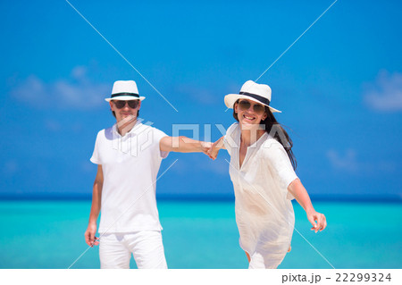 Young happy couple during beach tropical vacation Young happy couple during beach tropical vacation 22299324