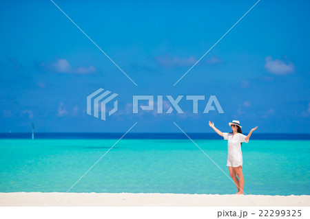 Young woman enjoy tropical beach vacation Young woman enjoy tropical beach vacation 22299325
