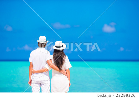 Young happy couple on white beach at summer Young happy couple on white beach at summer 22299326