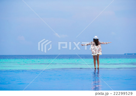 Beautiful young girl relaxing in outdoor swimming 22299529