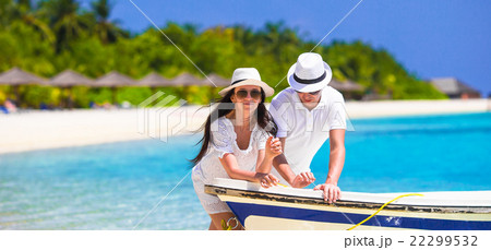 Young couple on white beach at summer vacation Young couple on white beach at summer vacation 22299532