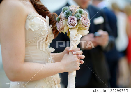 Bride holding a beautiful wedding bouquet Bride holding a beautiful wedding bouquet 22299785
