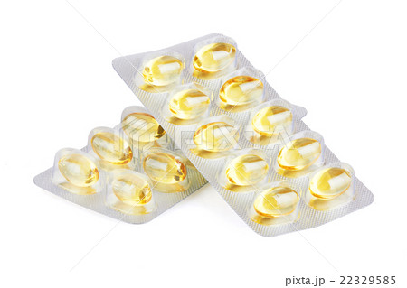 Yellow pills  on white 22329585