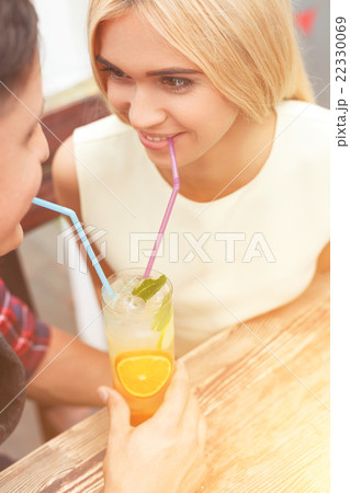 Cute loving couple is relaxing in cafe Cute loving couple is relaxing in cafe 22330069