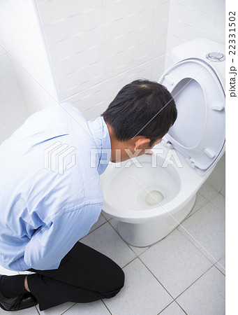 Young man drunk or sick vomiting 22331502