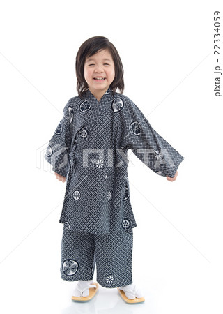 Happy asian boy in kimono standing on background 22334059